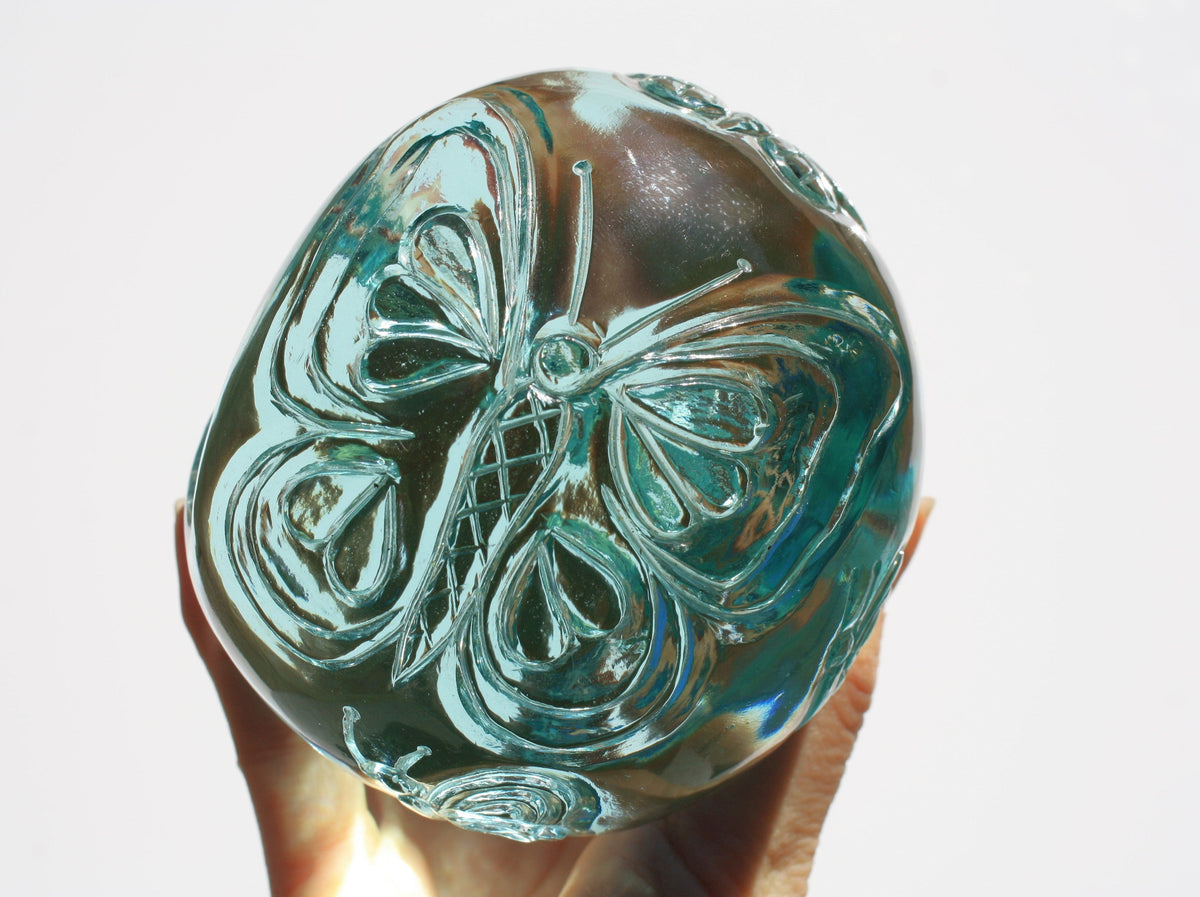 Blue obsidian crystal skull with hand engraved butterfly designs