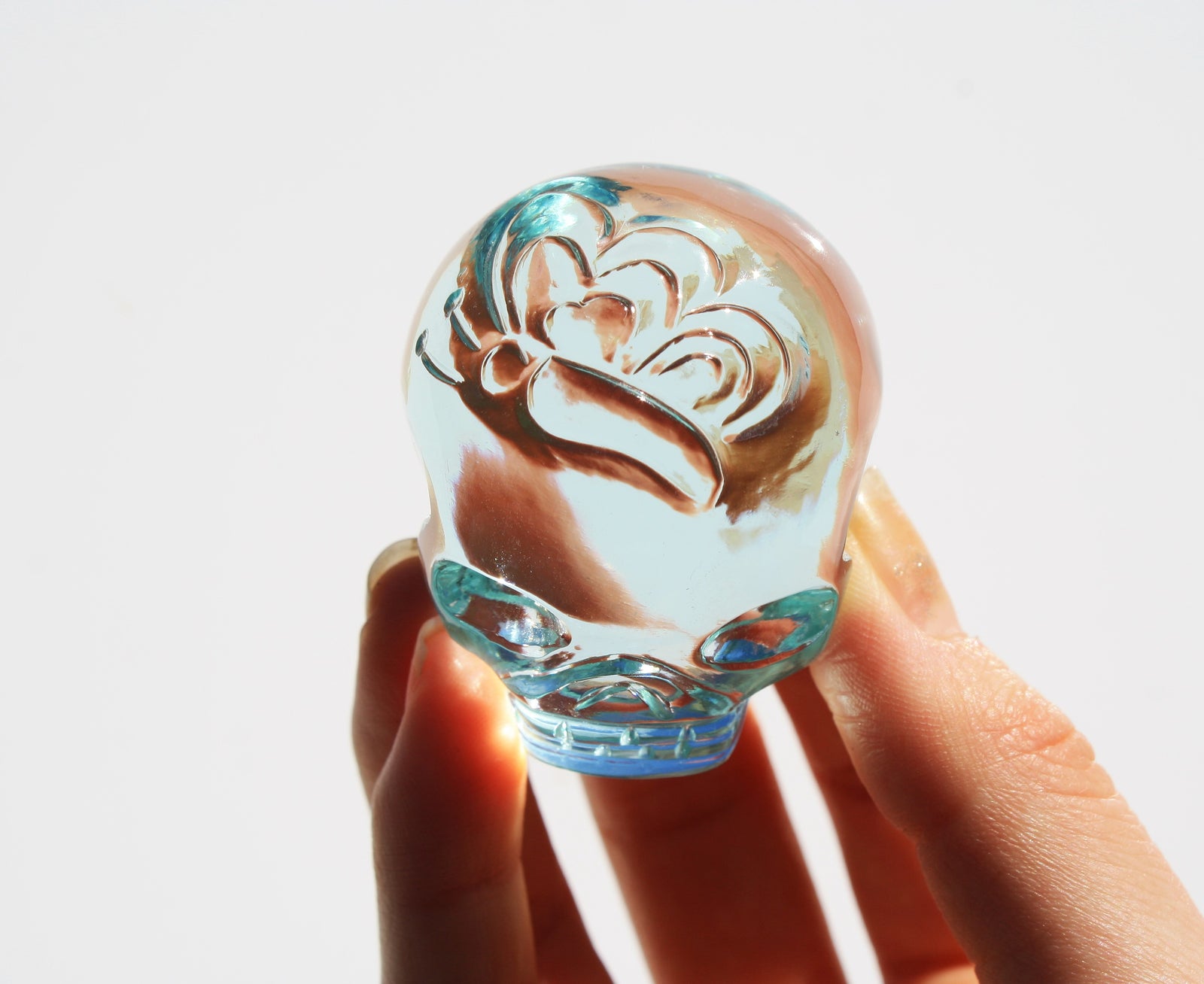 Blue obsidian crystal skull with hand engraved butterfly designs
