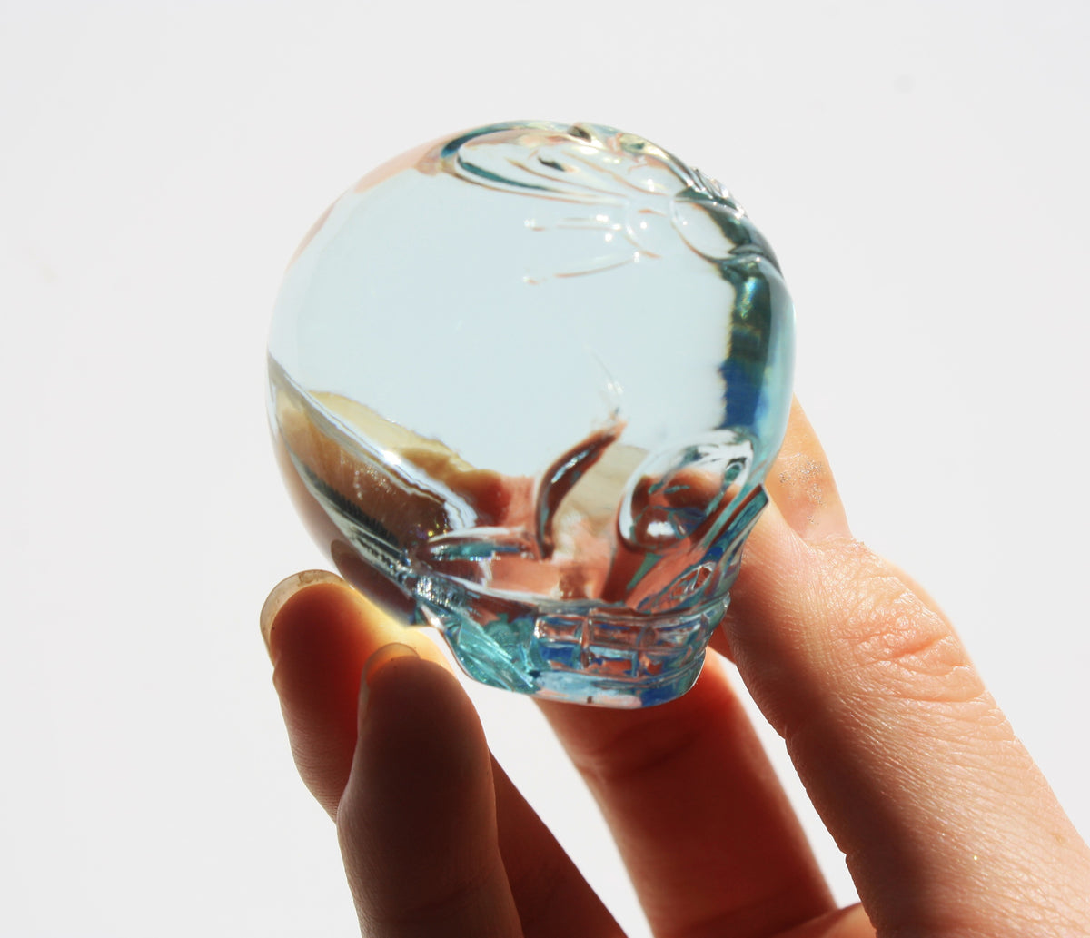 Blue obsidian crystal skull with hand engraved butterfly designs