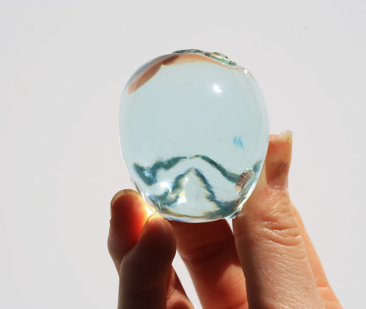 Blue obsidian crystal skull with hand engraved butterfly designs