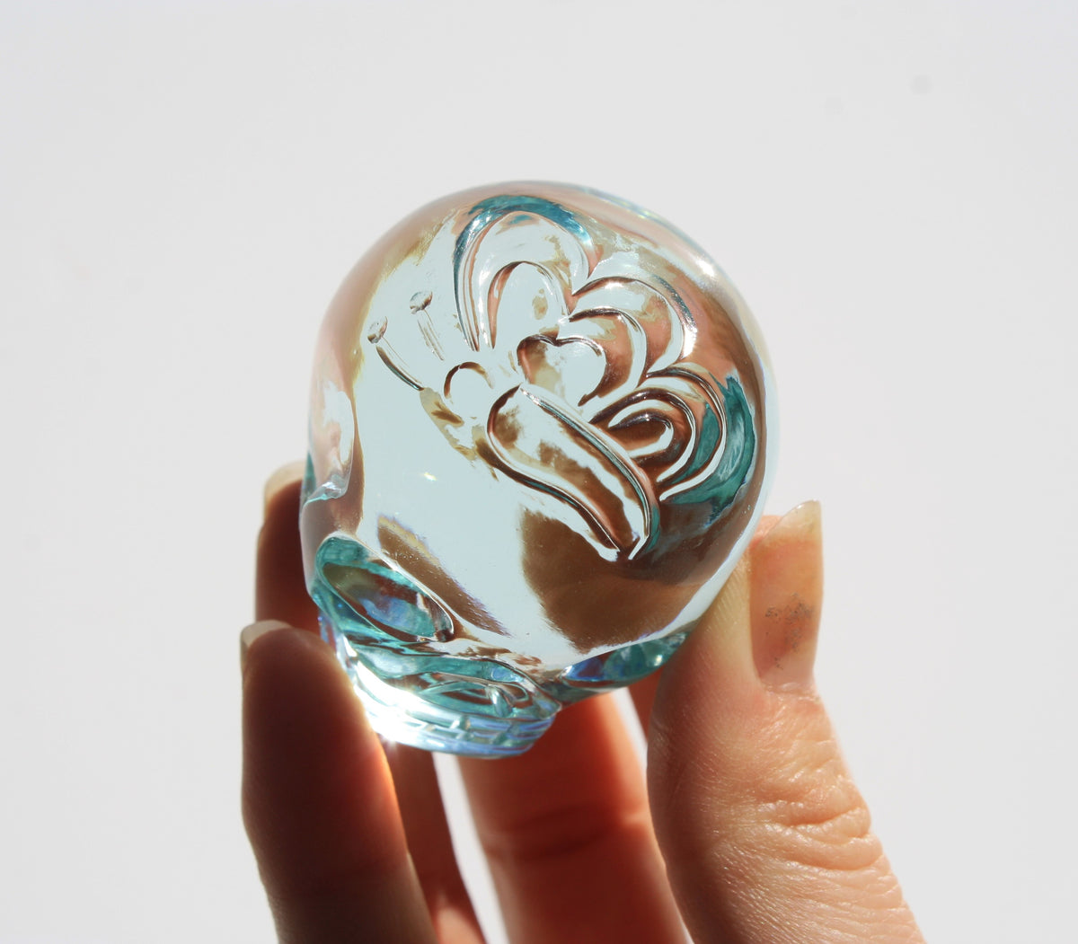 Blue obsidian crystal skull with hand engraved butterfly designs