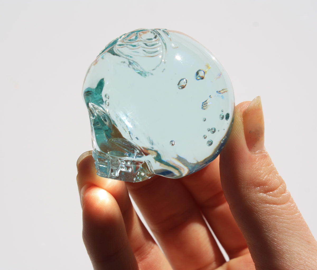 Blue obsidian crystal skull with hand engraved butterfly designs