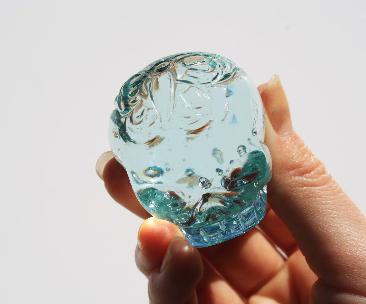 Blue obsidian crystal skull with hand engraved butterfly designs
