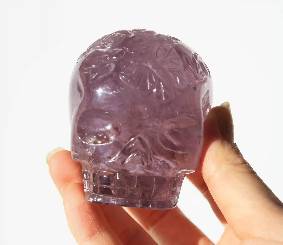 carved butterfly engraved amethyst crystal skull by vikas meena