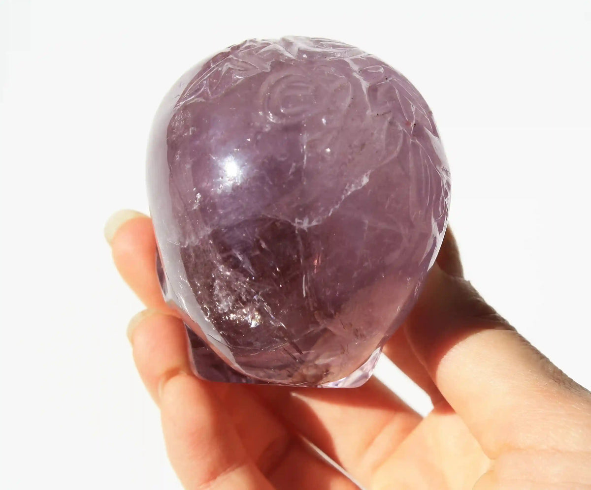 carved butterfly engraved amethyst crystal skull by vikas meena
