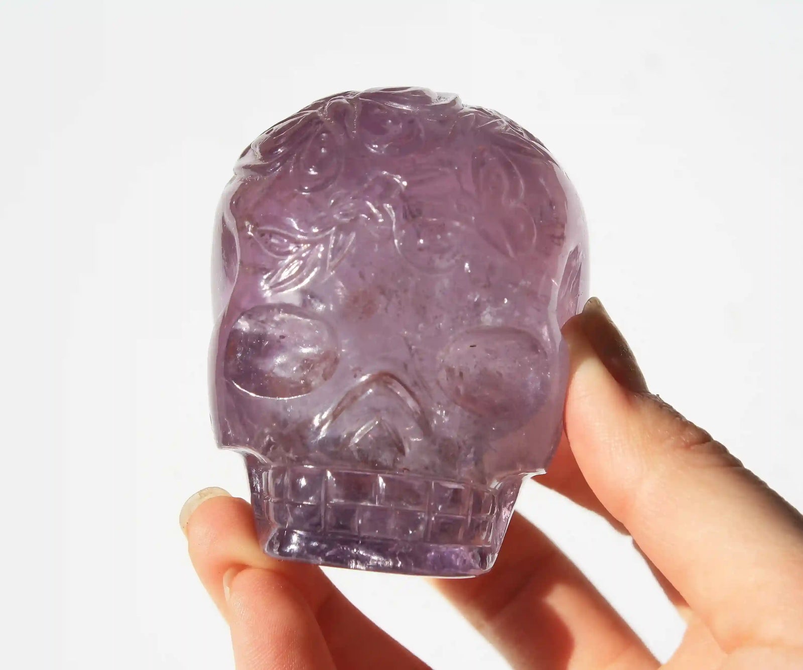 carved butterfly engraved amethyst crystal skull by vikas meena