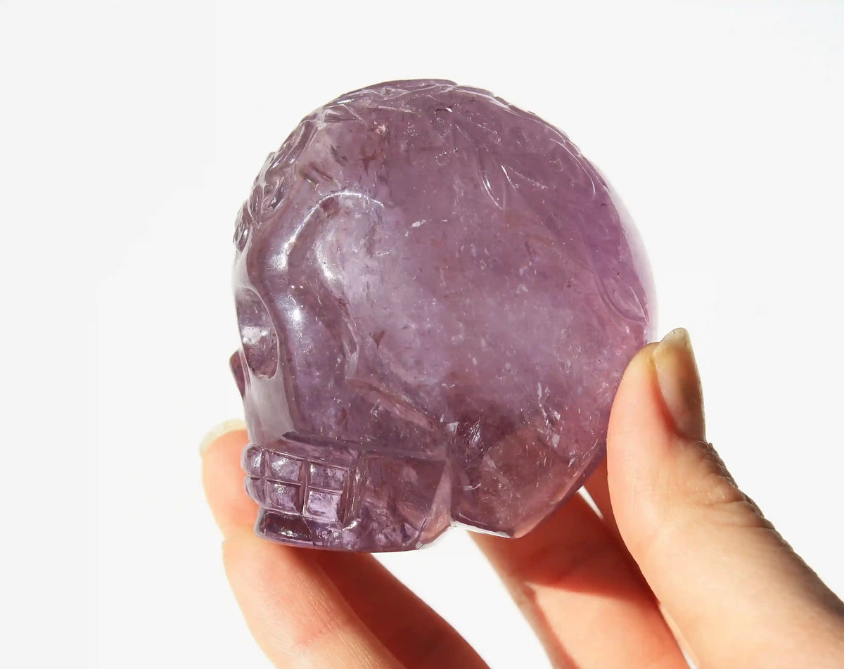 carved butterfly engraved amethyst crystal skull by vikas meena