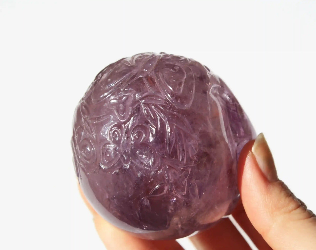 carved butterfly engraved amethyst crystal skull by vikas meena
