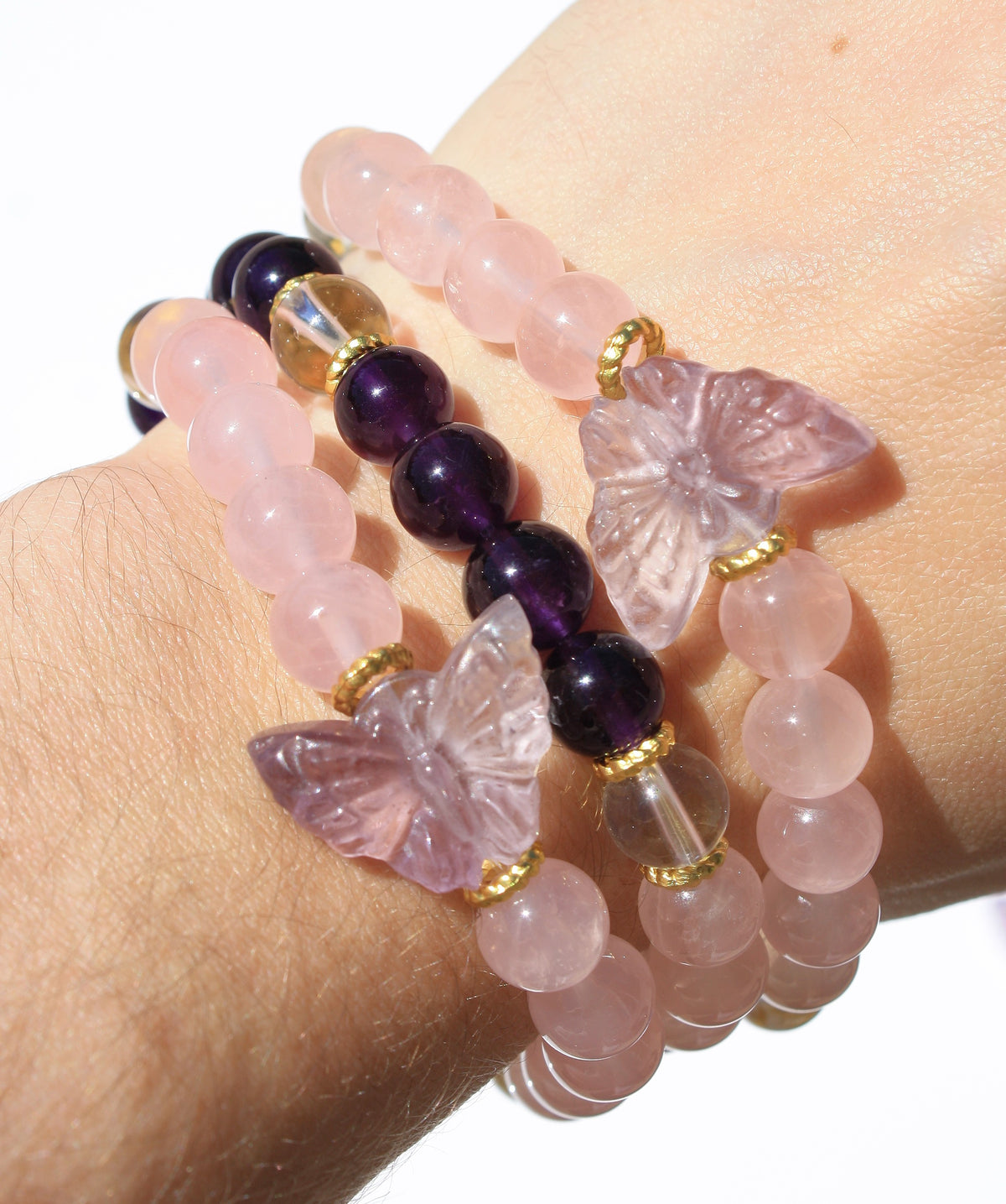 Beaded crystal bracelet with rose quartz and amethyst crystal and butterfly charms 