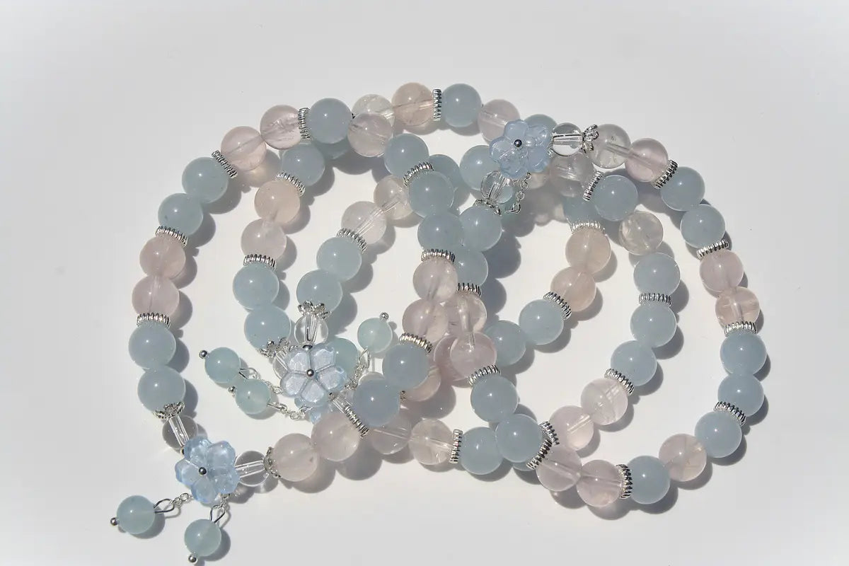 clear and rose quartz crystal bracelet with flower design