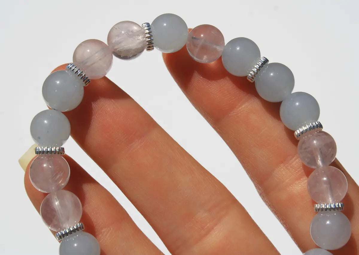 clear and rose quartz crystal bracelet with flower design
