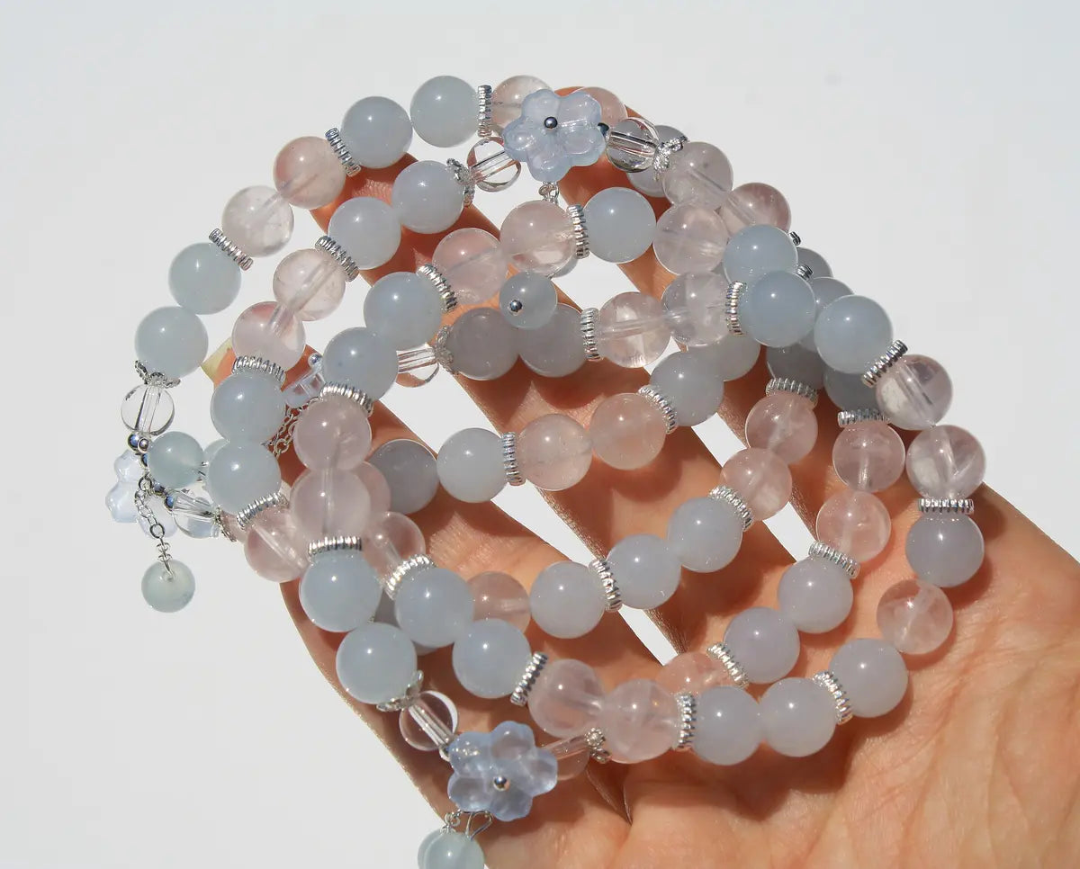 clear and rose quartz crystal bracelet with flower design