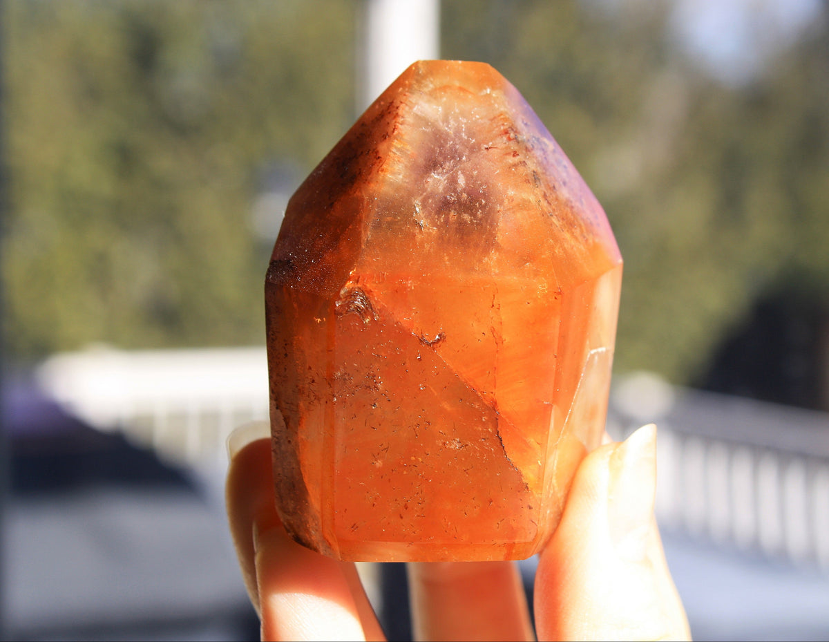 Red Dreamcoat Lemurian seed quartz tower with Super 7 inclusions and a Lemurian quartz core.