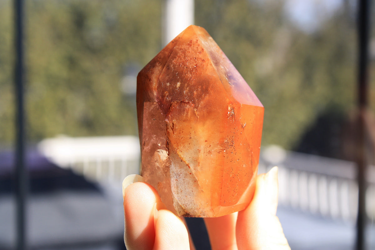 Red Dreamcoat Lemurian seed quartz tower with Super 7 inclusions and a Lemurian quartz core.