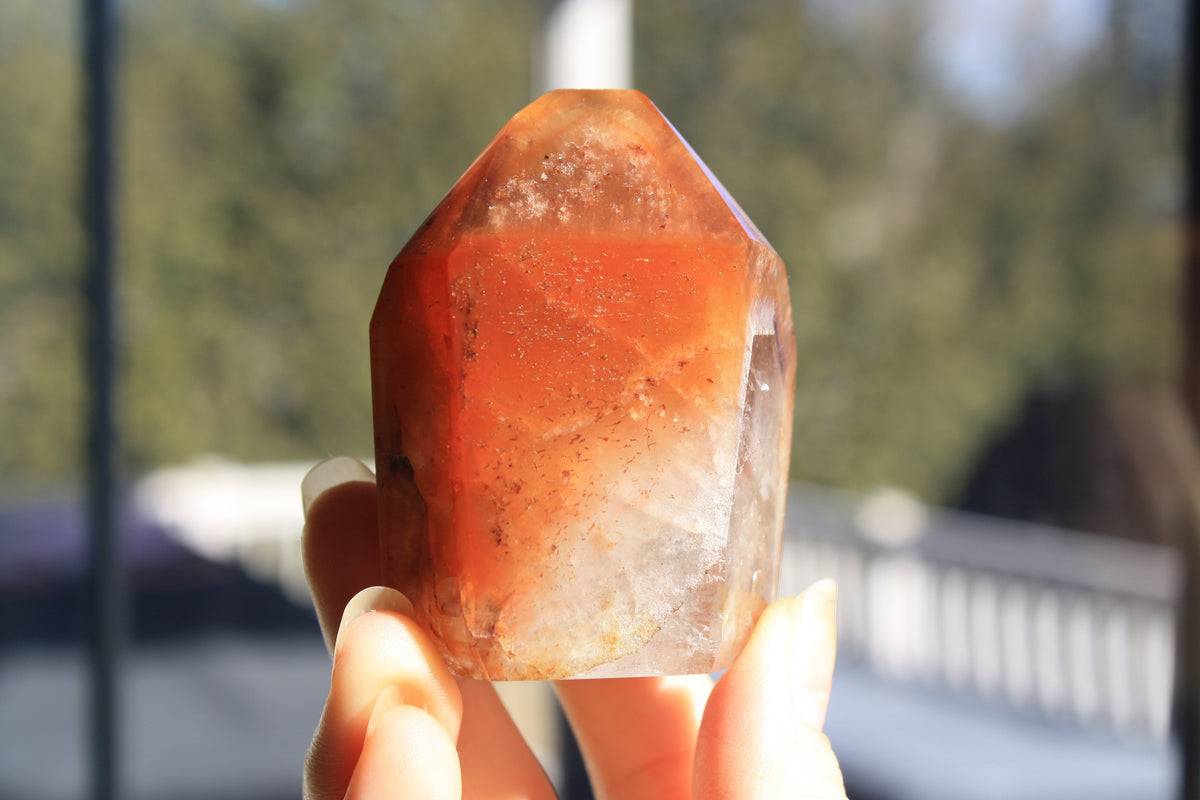Red Dreamcoat Lemurian seed quartz tower with Super 7 inclusions and a Lemurian quartz core.