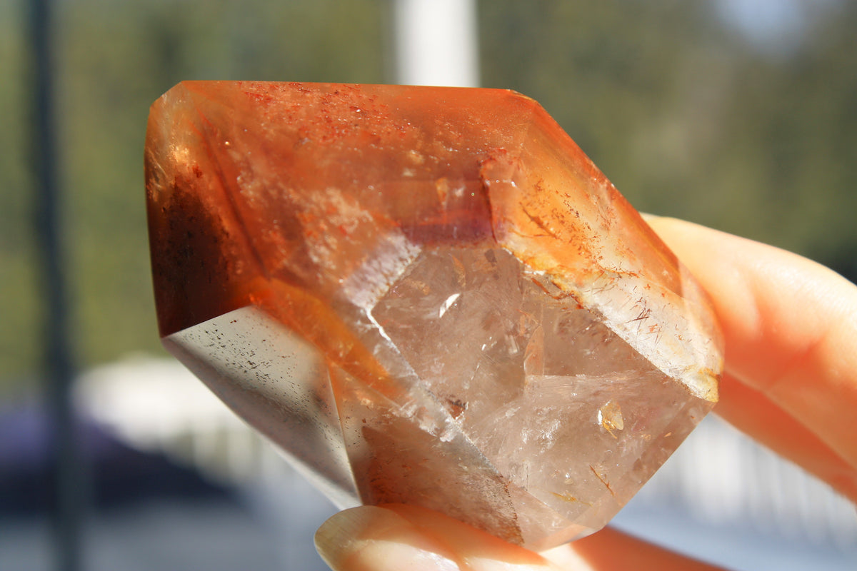 Red Dreamcoat Lemurian seed quartz tower with Super 7 inclusions and a Lemurian quartz core.