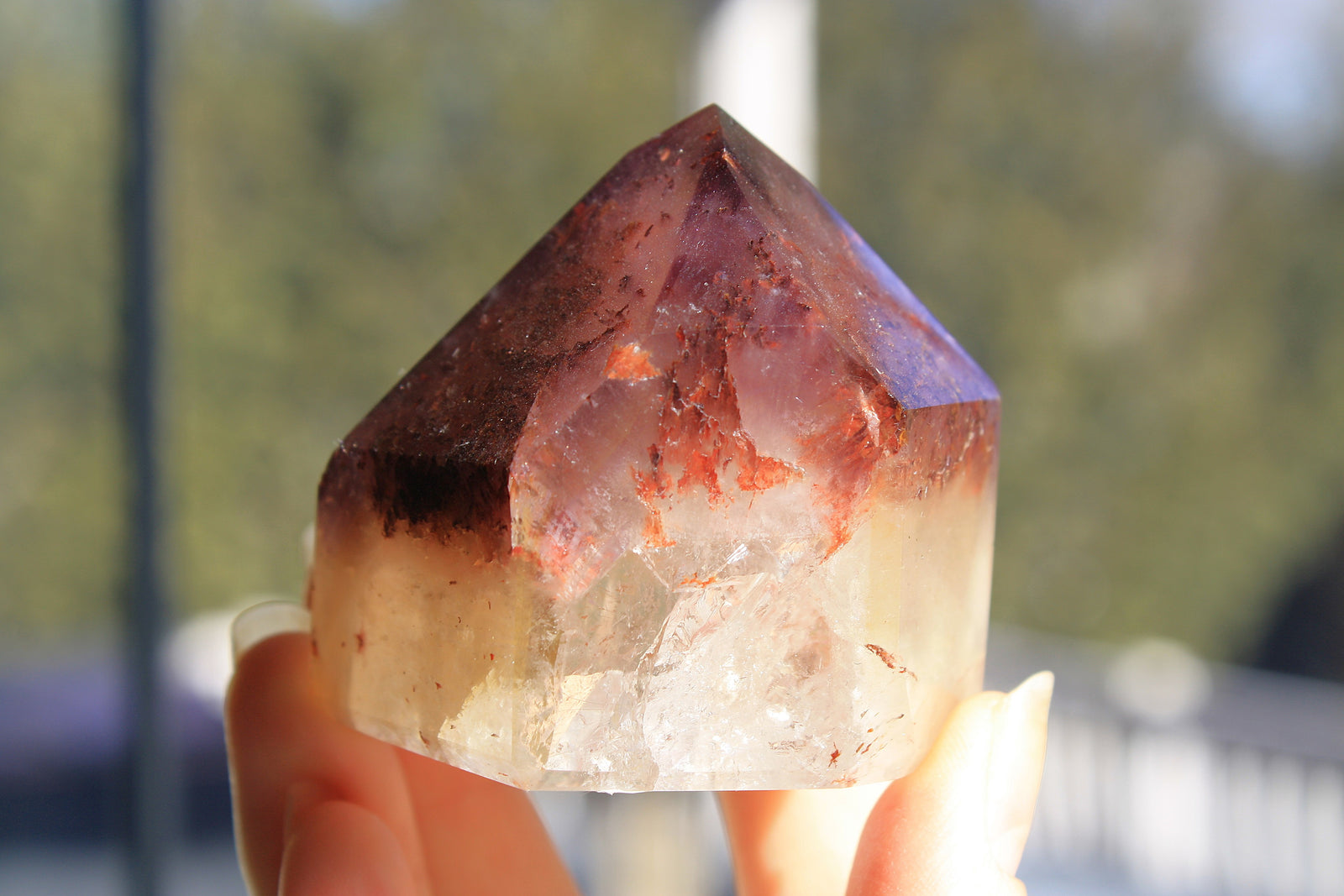 Red Dreamcoat Lemurian seed quartz tower with Super 7 inclusions and a Lemurian quartz core.