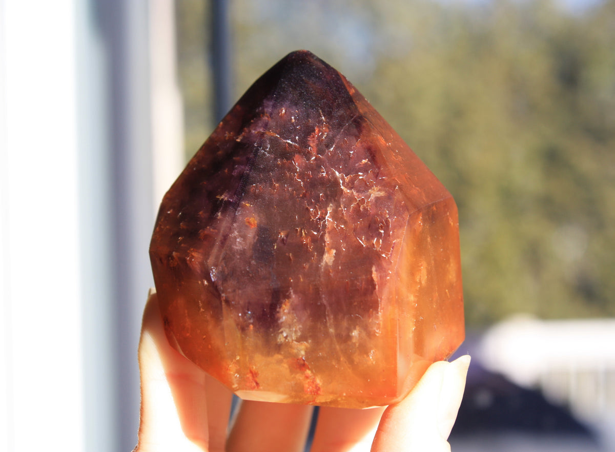Red Dreamcoat Lemurian seed quartz tower with Super 7 inclusions and a Lemurian quartz core.