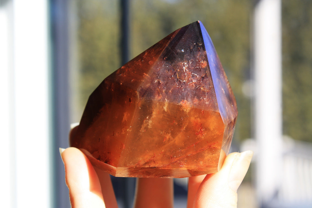 Red Dreamcoat Lemurian seed quartz tower with Super 7 inclusions and a Lemurian quartz core.