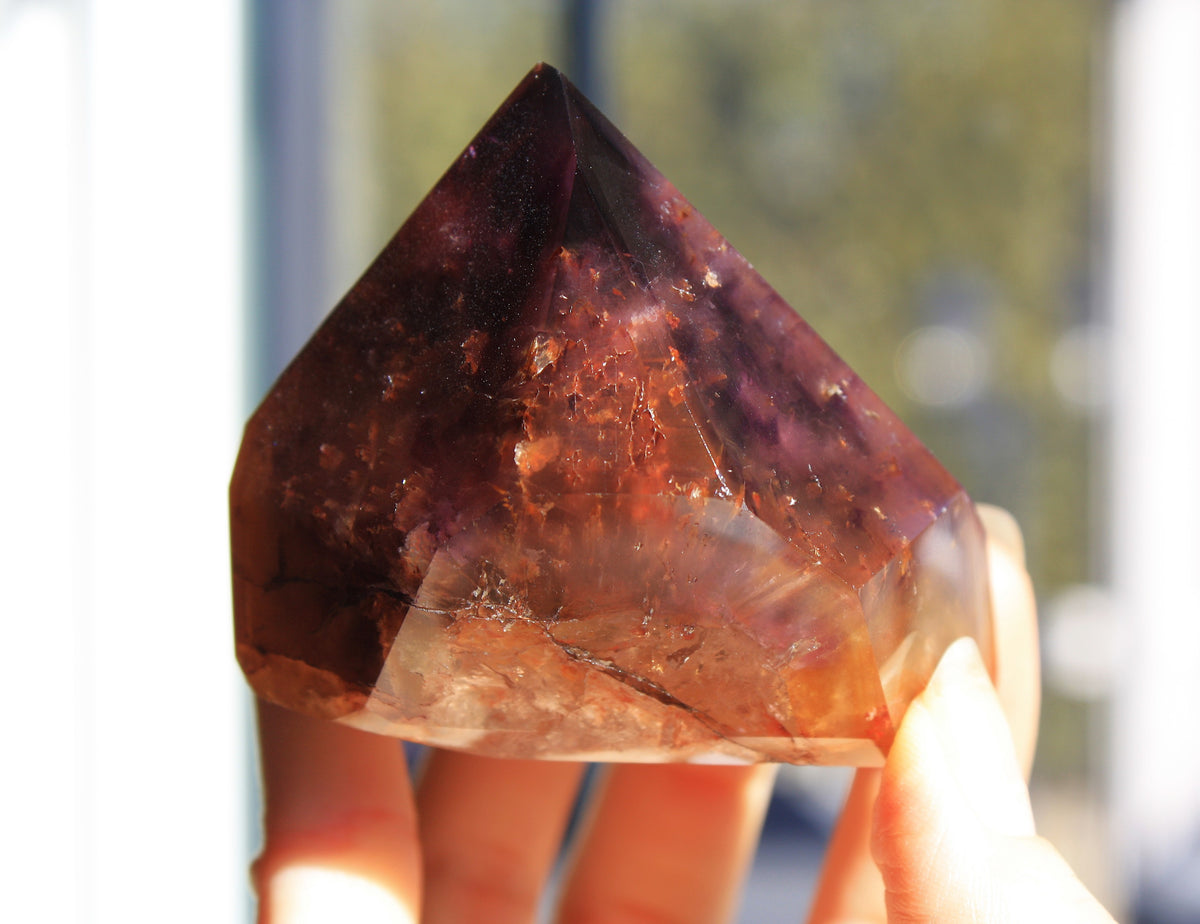 Red Dreamcoat Lemurian seed quartz tower with Super 7 inclusions and a Lemurian quartz core.