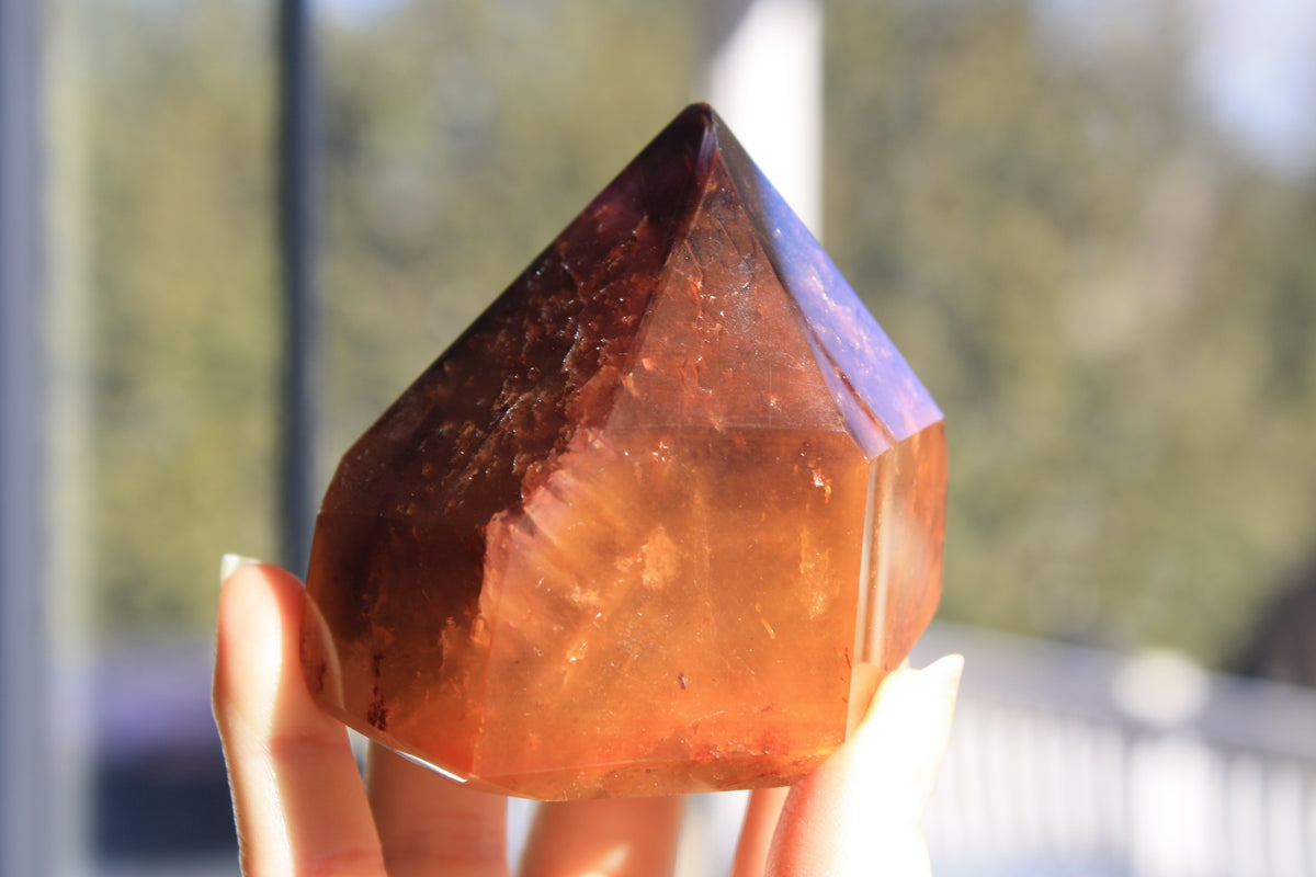 Red Dreamcoat Lemurian seed quartz tower with Super 7 inclusions and a Lemurian quartz core.