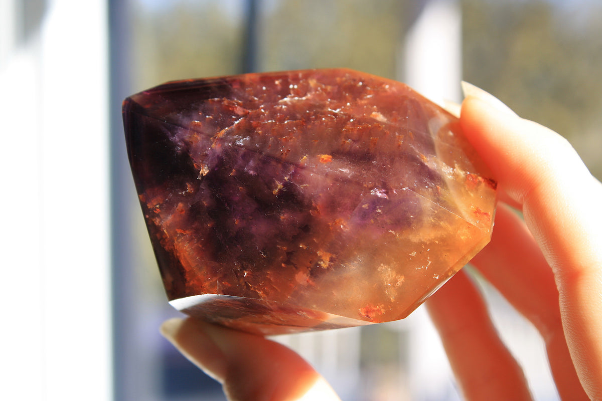 Red Dreamcoat Lemurian seed quartz tower with Super 7 inclusions and a Lemurian quartz core.