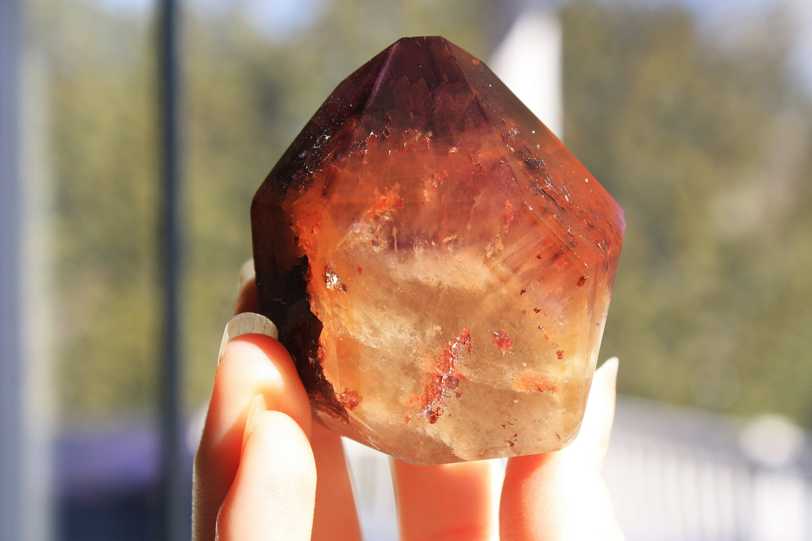 Red Dreamcoat Lemurian seed quartz tower with Super 7 inclusions and a Lemurian quartz core.