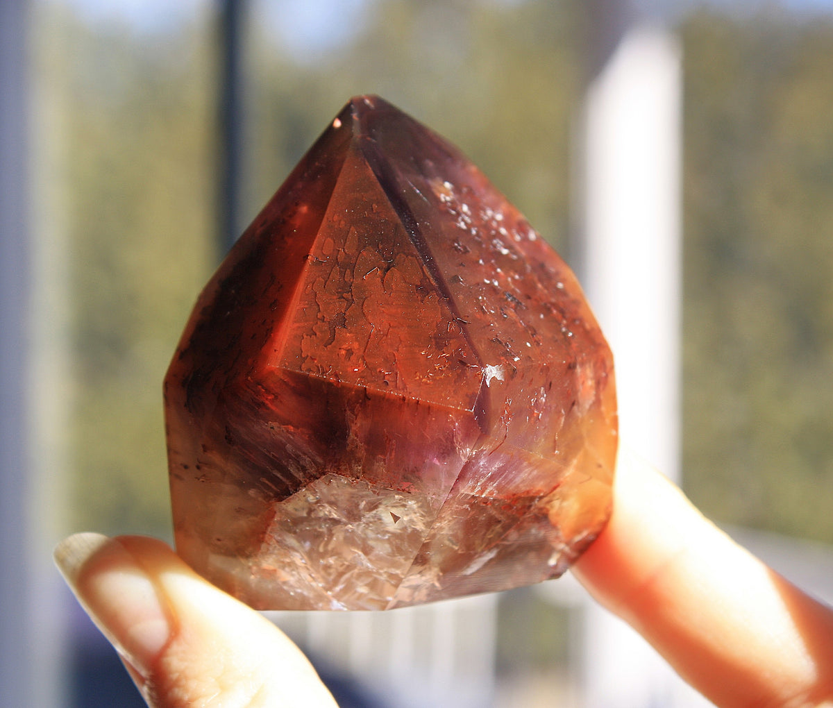 Red Dreamcoat Lemurian seed quartz tower with Super 7 inclusions and a Lemurian quartz core.