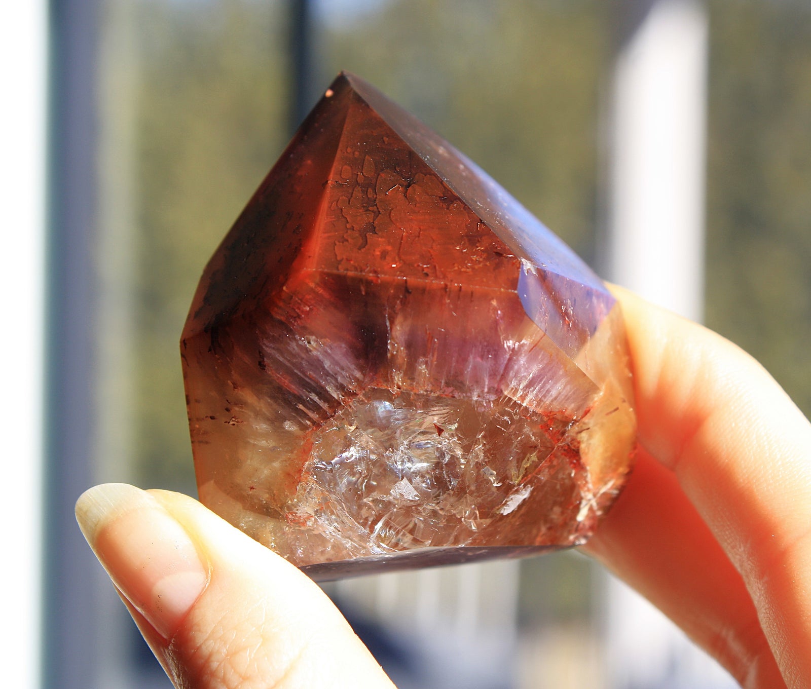 Red Dreamcoat Lemurian seed quartz tower with Super 7 inclusions and a Lemurian quartz core.