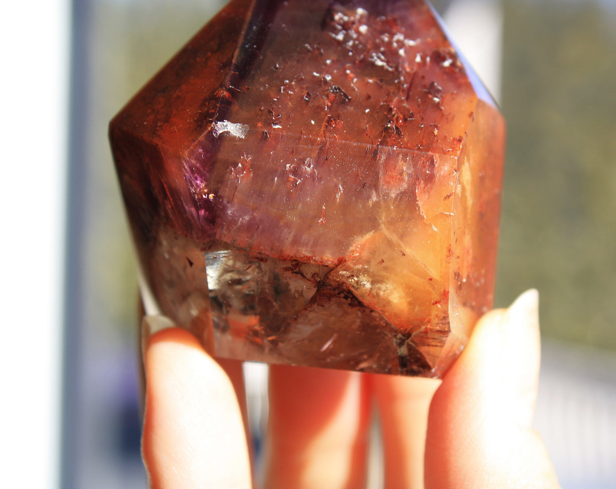 Red Dreamcoat Lemurian seed quartz tower with Super 7 inclusions and a Lemurian quartz core.