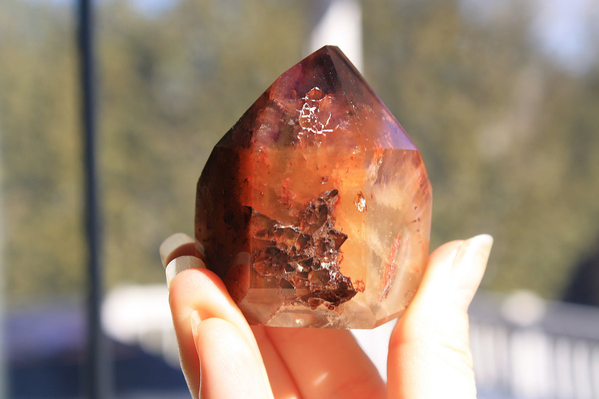Red Dreamcoat Lemurian seed quartz tower with Super 7 inclusions and a Lemurian quartz core.